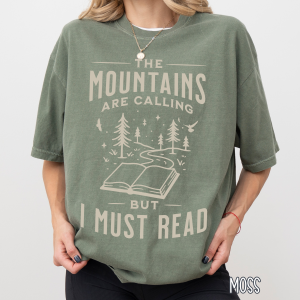 mountain themed image with book lover theme on a moss shirt